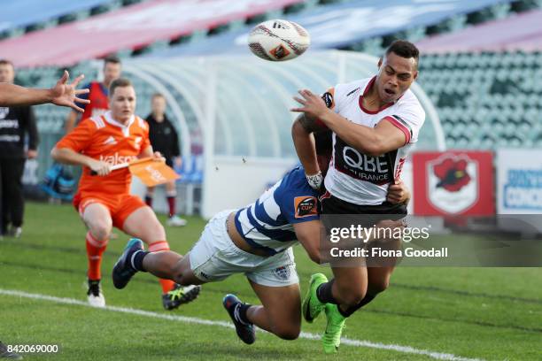 Tevita Li of North Harbour is tackled by Vince Aso of Auckland during the round three Mitre 10 Cup match between North Harbour and Auckland on...