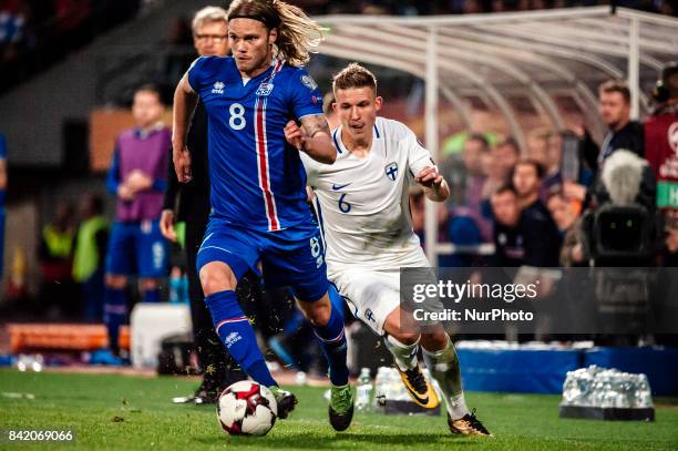 Finland's Alexander Ring chases Iceland's Birkir Bjarnason during the FIFA World Cup 2018 Group I football qualification match between Finland and...