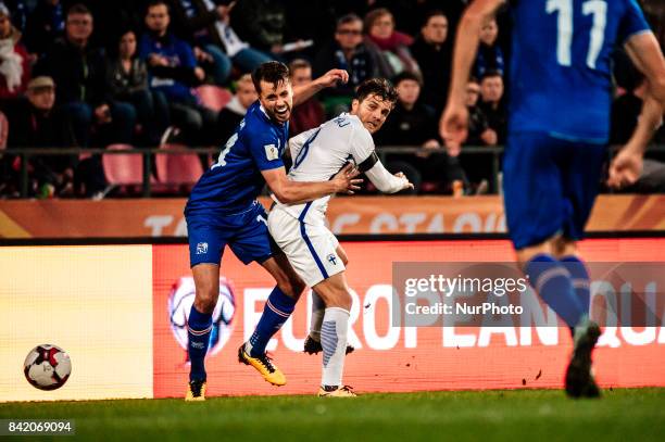 Iceland's Kári Árnason and Finland's Perparim Hetemaj during the FIFA World Cup 2018 Group I football qualification match between Finland and Iceland...