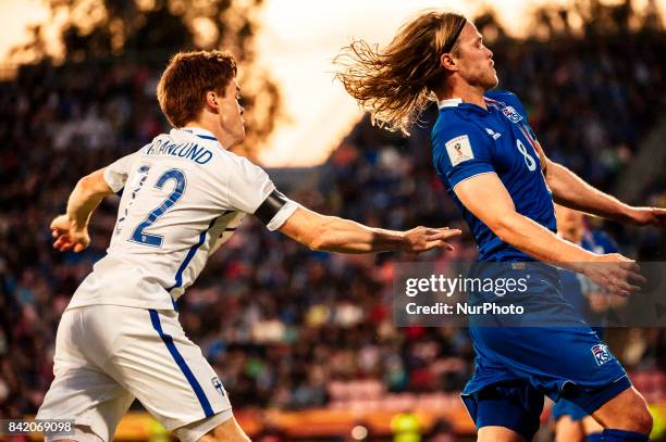 Finland's Albin Granlund and Iceland's Birkir Bjarnason during the FIFA World Cup 2018 Group I football qualification match between Finland and...