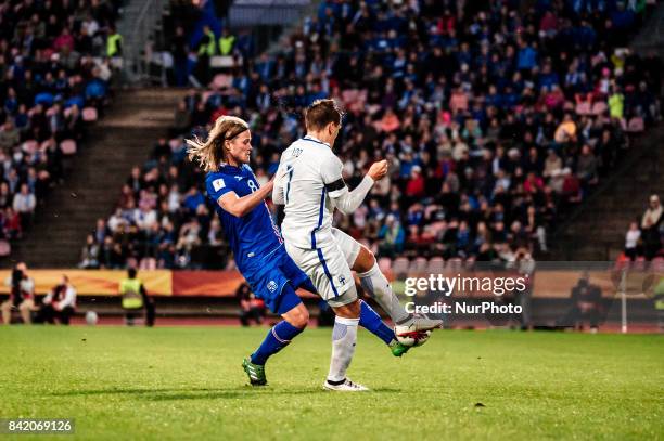 Iceland's Birkir Bjarnason and Finland's Robin Lod during the FIFA World Cup 2018 Group I football qualification match between Finland and Iceland in...