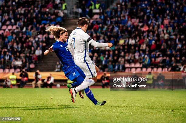 Iceland's Birkir Bjarnason and Finland's Robin Lod during the FIFA World Cup 2018 Group I football qualification match between Finland and Iceland in...