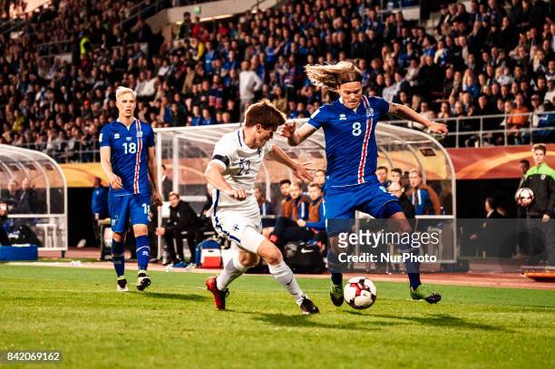 Finland's Albin Granlund and Iceland's Birkir Bjarnason during the FIFA World Cup 2018 Group I football qualification match between Finland and...