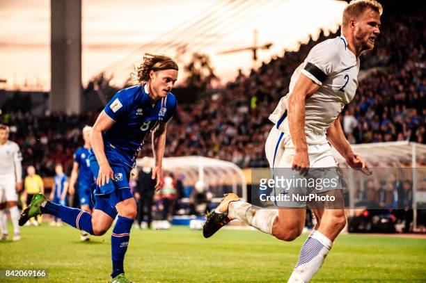 Iceland's Birkir Bjarnason and Finland's Paulus Arajuuri during the FIFA World Cup 2018 Group I football qualification match between Finland and...