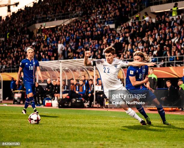 Finland's Albin Granlund and Iceland's Birkir Bjarnason during the FIFA World Cup 2018 Group I football qualification match between Finland and...