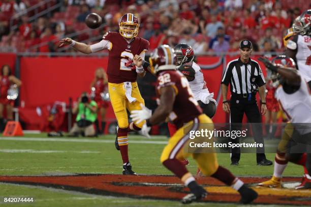 Washington Redskins quarterback Nate Sudfeld delivers a pass to Washington Redskins running back Samaje Perine over Tampa Bay Buccaneers defensive...