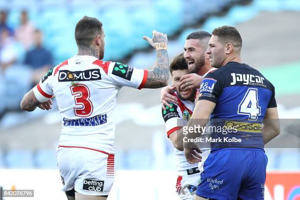 Joel Thompson of the Dragons celebrates with his team mates after scoring a try during the round 26 NRL match between the St George Illawarra Dragons...