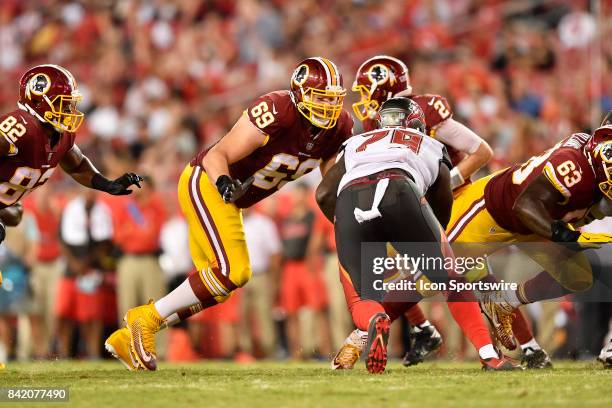 Washington Redskins guard Tyler Catalina looks to block Tampa Bay Buccaneers defensive end Tavaris Barnes during an NFL preseason football game...