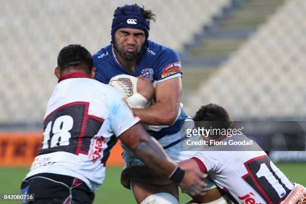 Taleni Seu of Auckland is tackled by Sione Mafileo of North Harbour and Bryn Gatland of North Harbour during the round three Mitre 10 Cup match...