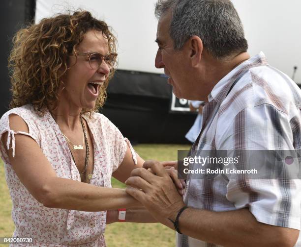 Actress Jennifer Grey and choreographer Kenny Ortega dance at the special screening of "Dirty Dancing" at Will Rogers State Historic Park on...