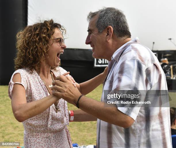 Actress Jennifer Grey and choreographer Kenny Ortega dance at the special screening of "Dirty Dancing" at Will Rogers State Historic Park on...