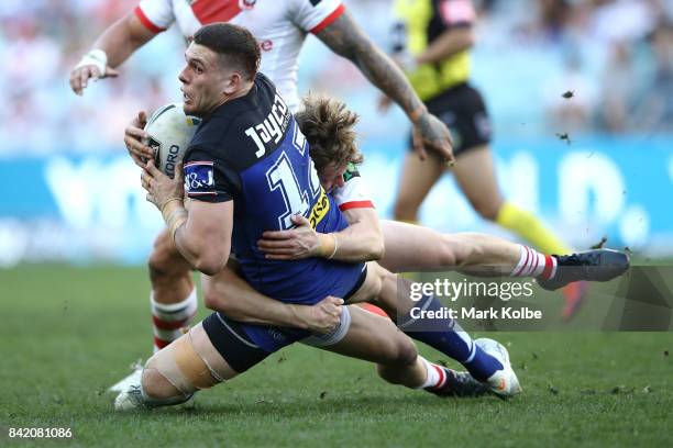 Adam Elliott of the Bulldogs is tackled during the round 26 NRL match between the St George Illawarra Dragons and the Canterbury Bulldogs at ANZ...