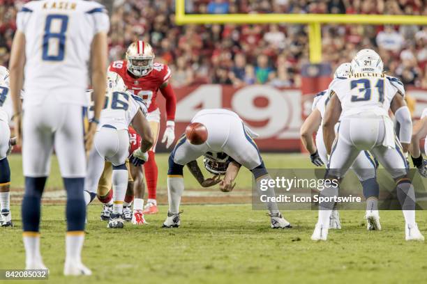 Los Angeles Chargers Long Snapper Mike Windt snaps the ball to Los Angeles Chargers Punter Drew Kaser during a preseason NFL game between the Los...