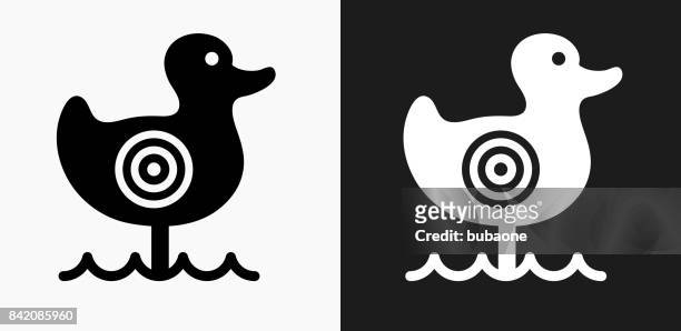 shooting duck game icon on black and white vector backgrounds - duck shooting game stock illustrations