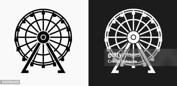 ferris wheel icon on black and white vector backgrounds - ferris wheel stock illustrations