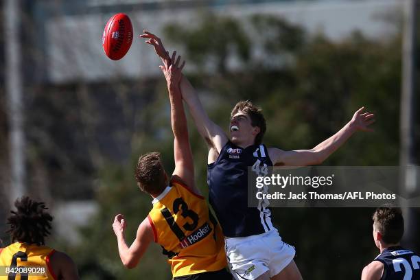 Riley Bowman of the Dandenong Stingrays and Jordon Reid of the Geelong Falcons compete for the ball during the TAC Cup round 18 match between Geelong...