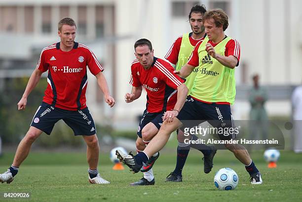 Franck Ribery of Bayern Muenchen battels for the ball with his team mates Christian Lell , Hamit Altintop and Andreas Ottl during the FC Bayern...