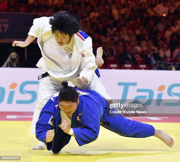 Sara Asahina of Japan and Yu Song of China compete in the women's over-78-kilogram final at the judo world championships in Budapest on Sept. 2,...