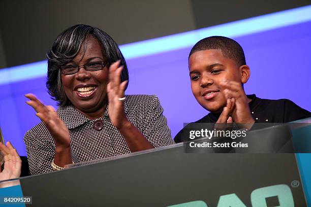 Christopher "The Notorious B.I.G." Wallace's mother Voletta Wallace and his son actor CJ Wallace ring the opening bell of the NASDAQ stock market on...