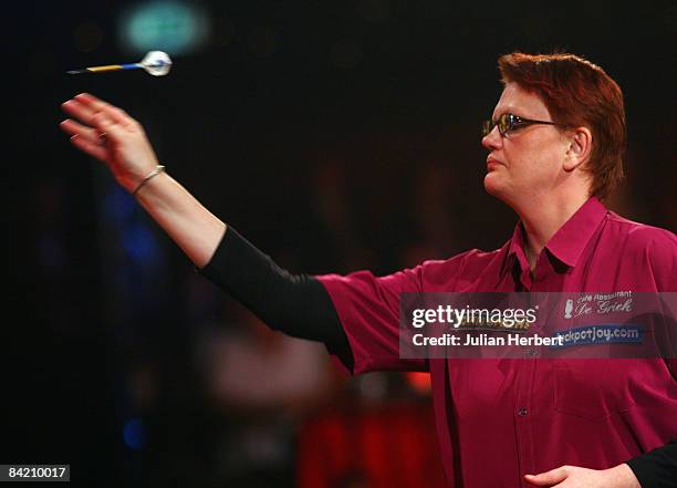 Karin Krappen of the Netherlands in action against Trina Gulliver of England during the Lakeside Women's World Professional Darts Championships...