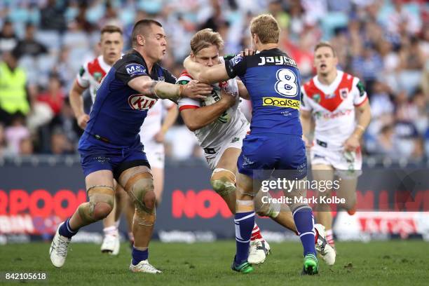 Jack de Belin of the Dragons is tackled during the round 26 NRL match between the St George Illawarra Dragons and the Canterbury Bulldogs at ANZ...