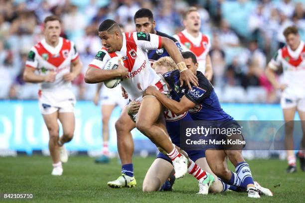 Nene MacDonald of the Dragons is tackled during the round 26 NRL match between the St George Illawarra Dragons and the Canterbury Bulldogs at ANZ...