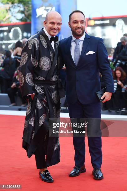Alessandro Maria Ferreri and Cristiano de Masi walk the red carpet ahead of the 'Suburbicon' screening during the 74th Venice Film Festival at Sala...