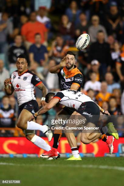 James Tedesco of the Tigers passes during the round 26 NRL match between the Wests Tigers and the New Zealand Warriors at Leichhardt Oval on...
