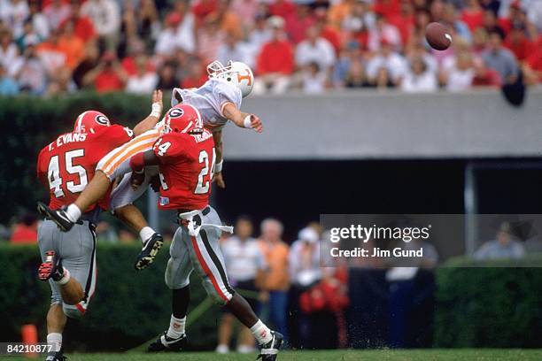 University of Tennessee Craig Faulkner in action vs University of Georgia Torrey Evans and Greg Tremble . Incomplete pass. Athens, GA 9/12/1992...