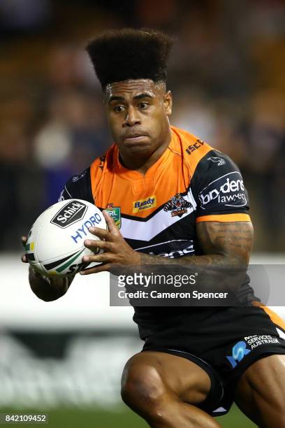Kevin Naiqama of the Tigers runs the ball during the round 26 NRL match between the Wests Tigers and the New Zealand Warriors at Leichhardt Oval on...