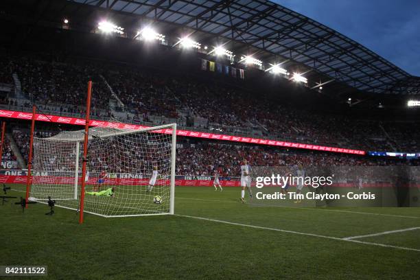 Marcos Urena of Costa Rica scores in the first half as he beats goalkeeper Tim Howard of the United States and defender Tim Ream of the United States...