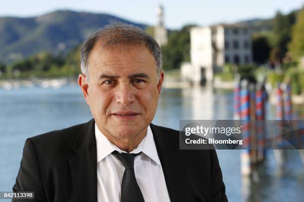 Nouriel Roubini, chairman at Roubini Global Economics and NYU Stern School of Business professor, poses for a photograph before a Bloomberg...