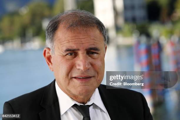 Nouriel Roubini, chairman at Roubini Global Economics and NYU Stern School of Business professor, poses for a photograph before a Bloomberg...