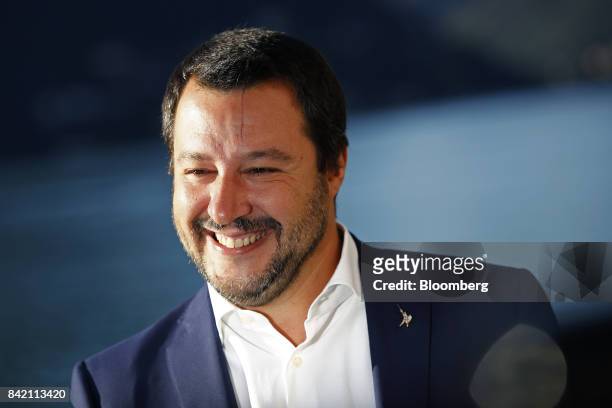 Matteo Salvini, head of Italy's Northern League, smiles as he poses for a photograph during the Ambrosetti Forum in Cernobbio, Italy, on Sunday,...