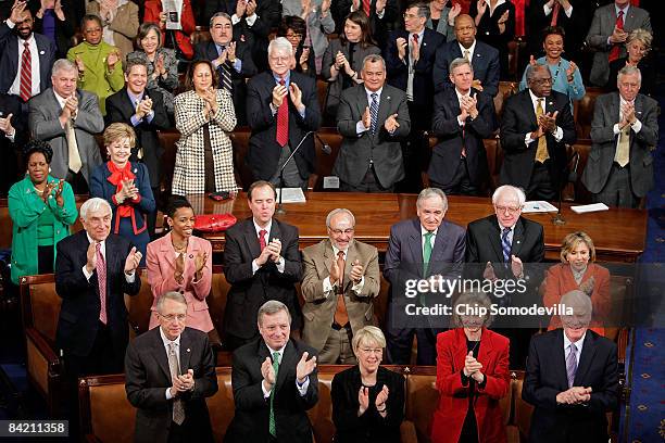 Senate and House Democratic members stand and applaud during a joint session of Congress to count the Electoral College vote from the 2008...