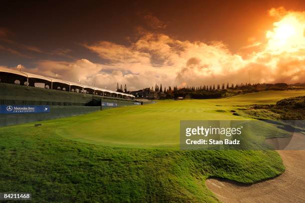 The sun rises over the 18th hole during the first round of the Mercedes-Benz Championship held at Plantation Course at Kapalua on January 8, 2009 in...