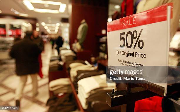 Sale sign is on display in Macy's flagship store January 8, 2009 in New York City. Macy's will close 11 stores in nine states following a weak...