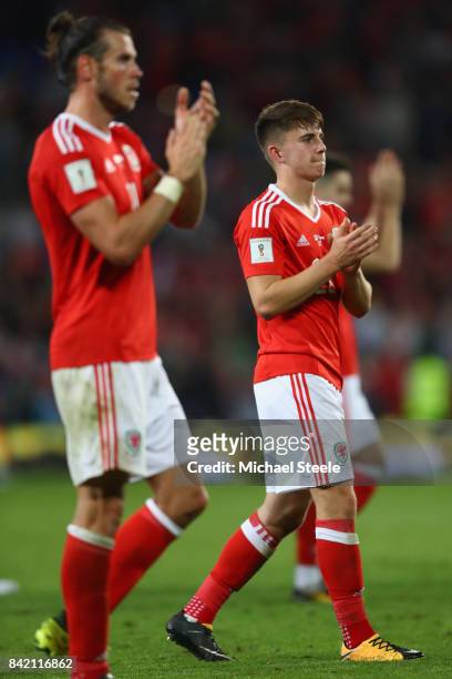 Ben Woodburn of Wales alongside Gareth Bale applaud the home supporters after their side's 1-0 victory during the FIFA 2018 World Cup Qualifier Group...