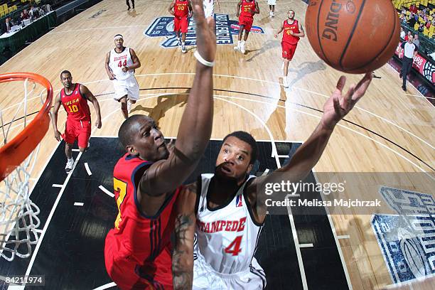 Jamaal Tatum of the Idaho Stampede goes up for a shot against Moses Ehambe of the Tulsa 66ers at McKay Events Center during the NBA D-League Showcase...