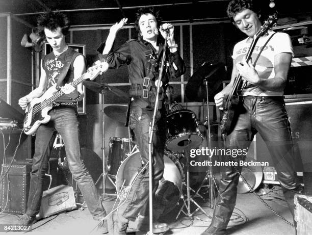 The Sex Pistols : Sid Vicious, Johnny Rotten, Paul Cook and Steve Jones perform onstage in a London venue, 1977.