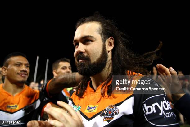 Aaron Woods of the Tigers is applauded as he leaves the field after playing his final game for the Tigers during the round 26 NRL match between the...