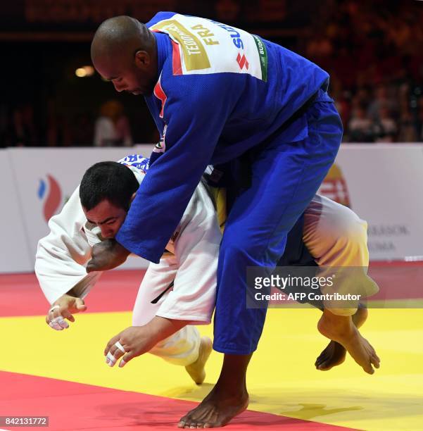 France's Teddy Riner competes with Brazil's David Moura in their final match of the mens +100kg category at the World Judo Championships in Budapest...