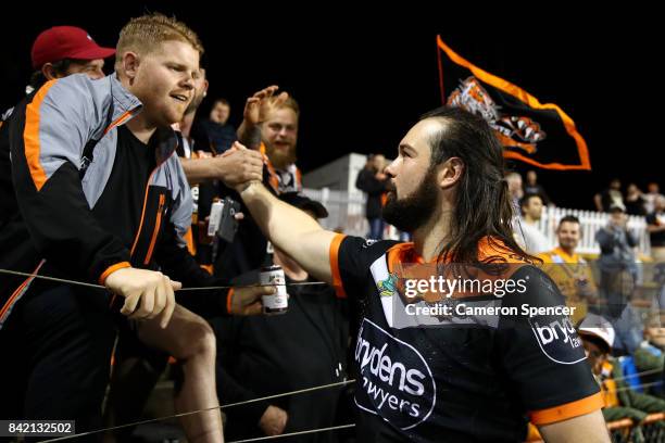 Aaron Woods of the Tigers thanks the crowd after winning the round 26 NRL match between the Wests Tigers and the New Zealand Warriors at Leichhardt...