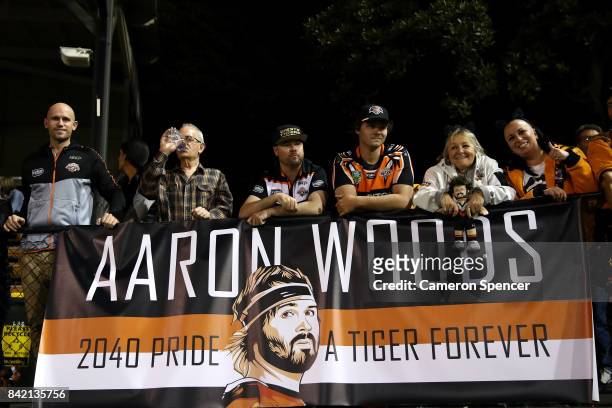 Tigers fans display a sign for Aaron Woods during the round 26 NRL match between the Wests Tigers and the New Zealand Warriors at Leichhardt Oval on...