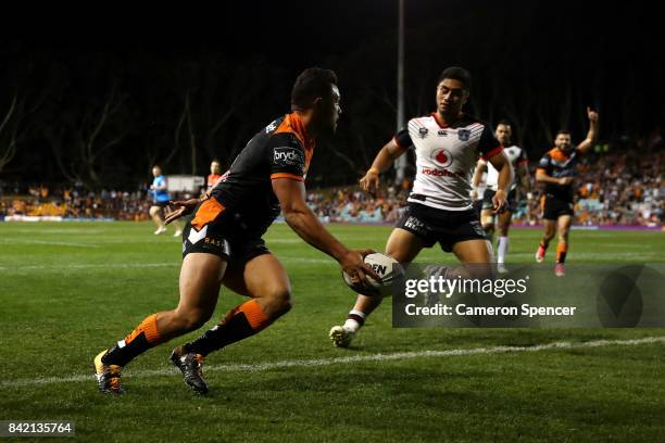 David Nofoaluma of the Tigers scores a try during the round 26 NRL match between the Wests Tigers and the New Zealand Warriors at Leichhardt Oval on...