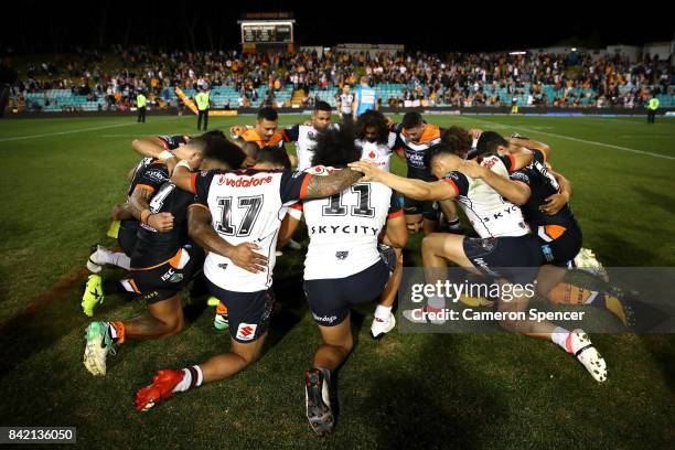 Tigers and Warriors players pray following the round 26 NRL match between the Wests Tigers and the New Zealand Warriors at Leichhardt Oval on...