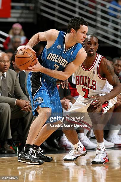 Redick of the Orlando Magic drives the ball against Ben Gordon of the Chicago Bulls during the game at the United Center on December 31, 2008 in...