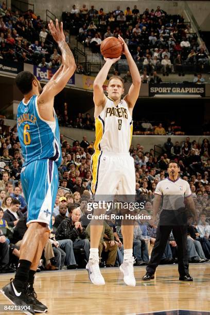 Rasho Nesterovic of the Indiana Pacers shoots a jumper against Tyson Chandler of the New Orleans Hornets during the game on December 28, 2008 at...
