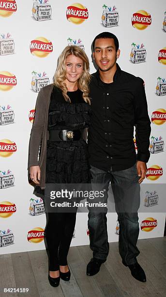 Theo Walcott and Melanie Slade attend the 'Do Us A Flavour' Walkers launch party at Paramount on January 8, 2009 in London, England.