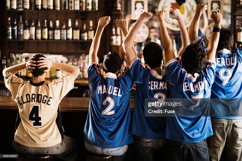 Soccer Fans Cheering in Bar